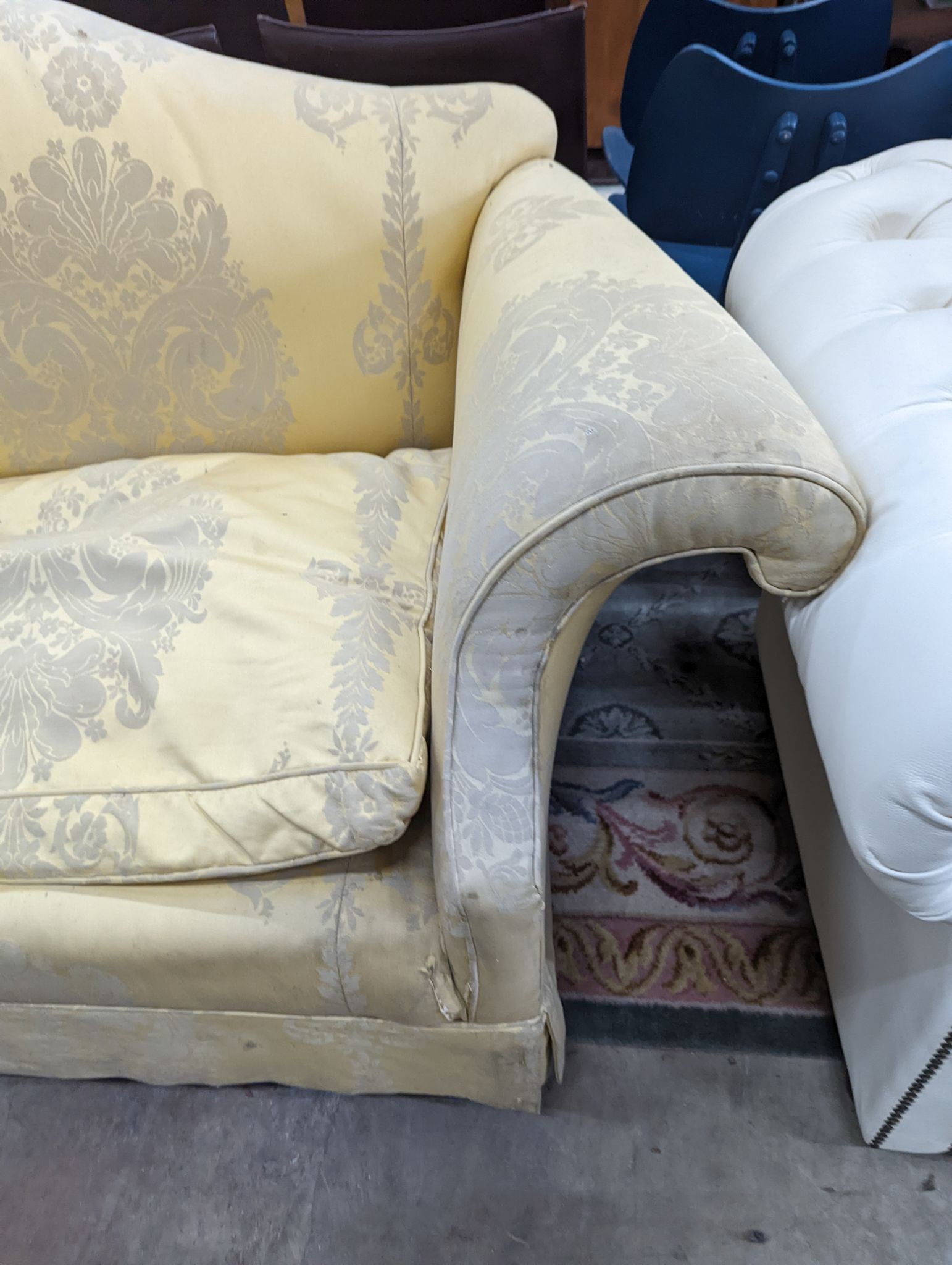 A George III style two seater upholstered scroll arm settee, length 200cm, depth 86cm, height 80cm